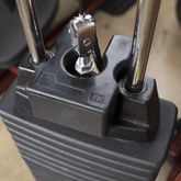5 lb. weight stack adapter plate securely attached to a machine weight stack, showcasing its robust design made from virgin rubber.